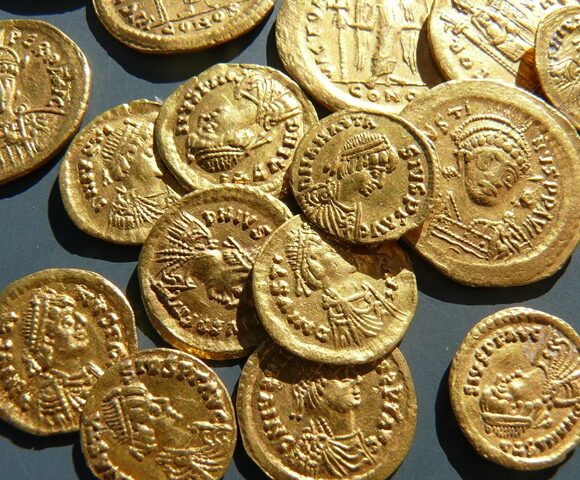 Bronze belt plate and hoard of coins